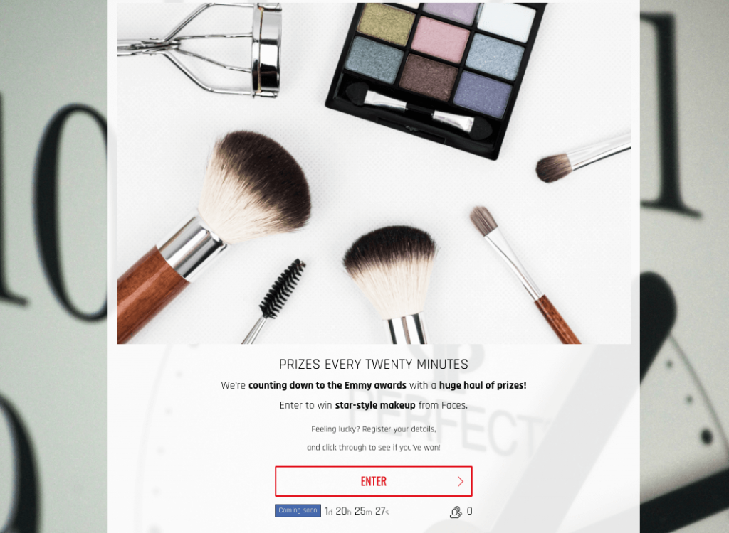 Screenshot of an instant win Emmys giveway. The image shows a collection of make up and cosmetics. The landing page explains that a prize will be awarded every 20 minutes, while users sign up at random.