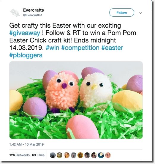 Example of an Easter giveaway on Twitter. The image shows green tissue paper, papier-mache eggs, and two chicks made out of wool pompoms.