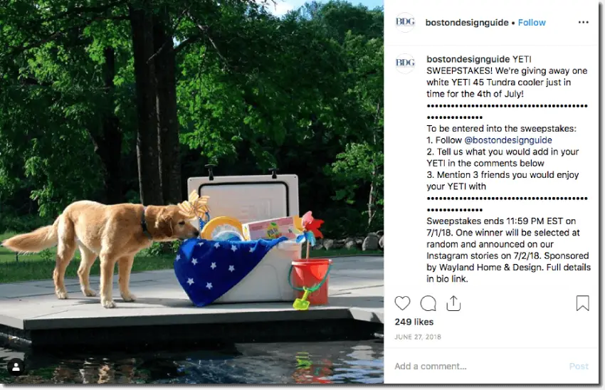 Screenshot of an Independence Day giveaway on Instagram. The image shows a golden retriever beside a swimming pool, next to a Yeti coolbox filled with toys and United States flags. The caption invites users to comment what they would put in the Yeti for the chance to win it on the 4th of July.