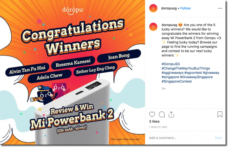 Screenshot of an Instagram post announcing the winners of a giveaway. The image shows a bright orange explosion with clouds of smoke. The overlay text reads, "Congratulations winners", followed by the winners' names.