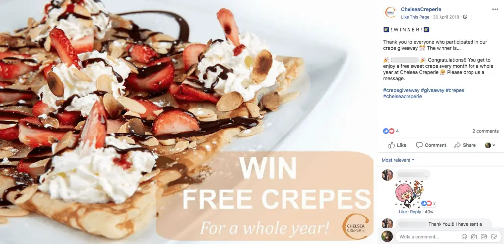 A Pancake Day giveaway post on Facebook. The image shows crepes with strawberries, cream and chocolate, with the title "Win free crepes for a whole year!". The caption announces the winner of the giveaway.