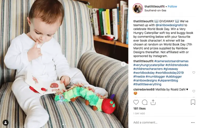 Instagram giveaway to promote a toy on social media. The image shows a baby sitting in an armchair, with a Very Hungry Caterpillar soft toy and a children's picture book. The caption explains the giveaway rules and prize.