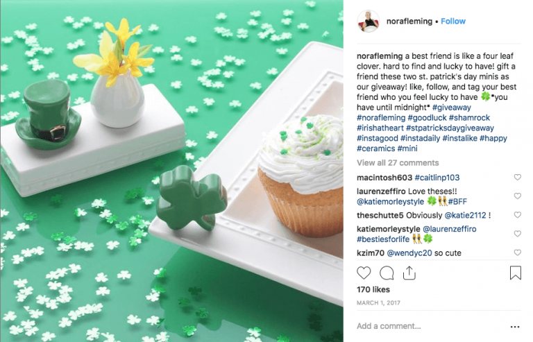 Instagram post announcing a St Patrick's Day giveaway. The image shows a shamrock and green hat cake topper, against a green background, with a vase of flowers and a green and white iced cake.