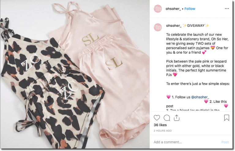 Screenshot of an Instagram giveaway to promote a fashion collection. The image shows two monogrammed satin pyjama sets, one leopard print, one pink and gold. The caption explains that followers can win a set for them and a friend when they follow, like, comment, and tag.